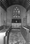A view of the chancel. The oak reading desk at the entrance to the chancel was installed in 1928